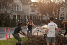 Council Member Kamin Pulling Tree Branches