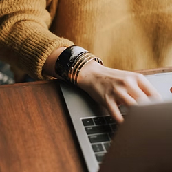 Typing at a Laptop