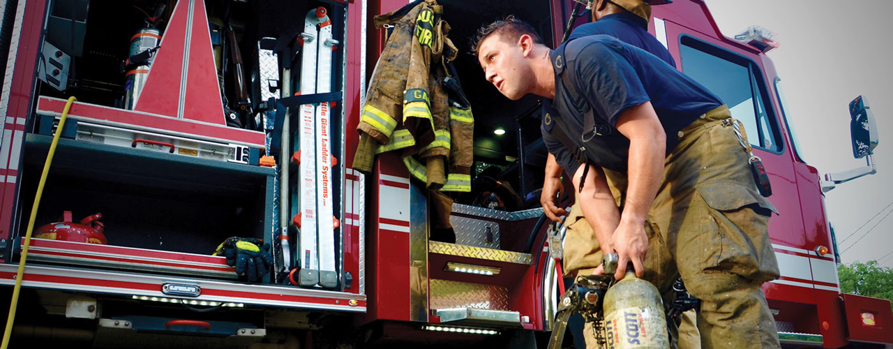 firefighter putting on gear