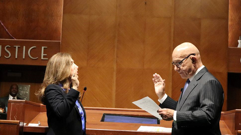 Nelly Santos being sworn in