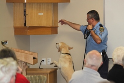 HPD Senior Police Officer F. Belmarez demonstrates the skills of his K-9 partner